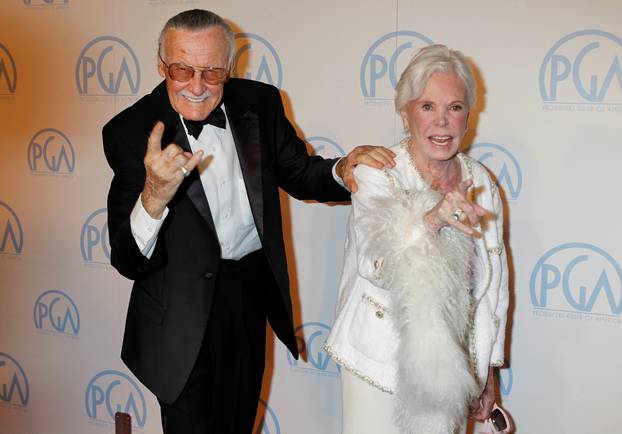 FILE PHOTO - Stan Lee, former president and chairman of Marvel Comics, and wife Joan gesture as they arrive at the 23rd annual Producers Guild Awards in Beverly Hills