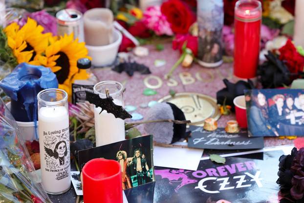 Flowers and pictures are placed on the star of late Ozzy Osbourne at the Hollywood Walk of Fame in Los Angeles