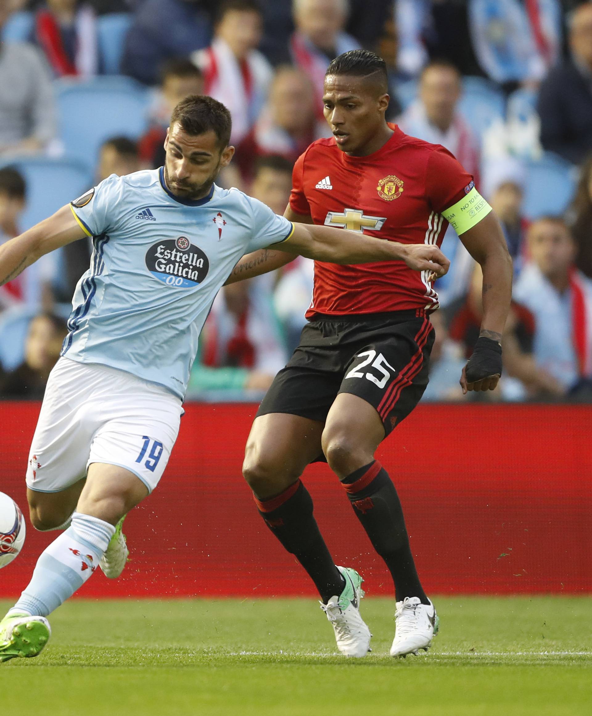 Celta Vigo's Jonathan Castro Otto in action with Manchester United's Antonio Valencia