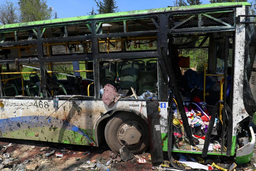 FILE PHOTO: A damaged bus is seen after an explosion at insurgent-held al-Rashideen