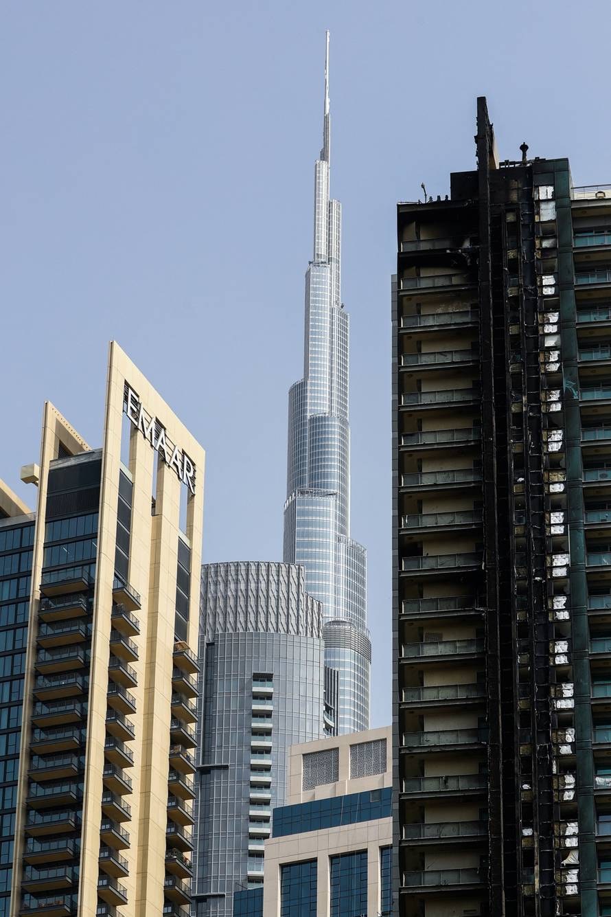 Fire damage is visible on the 8 Boulevard Walk high-rise building located near Burj Khalifa in Dubai
