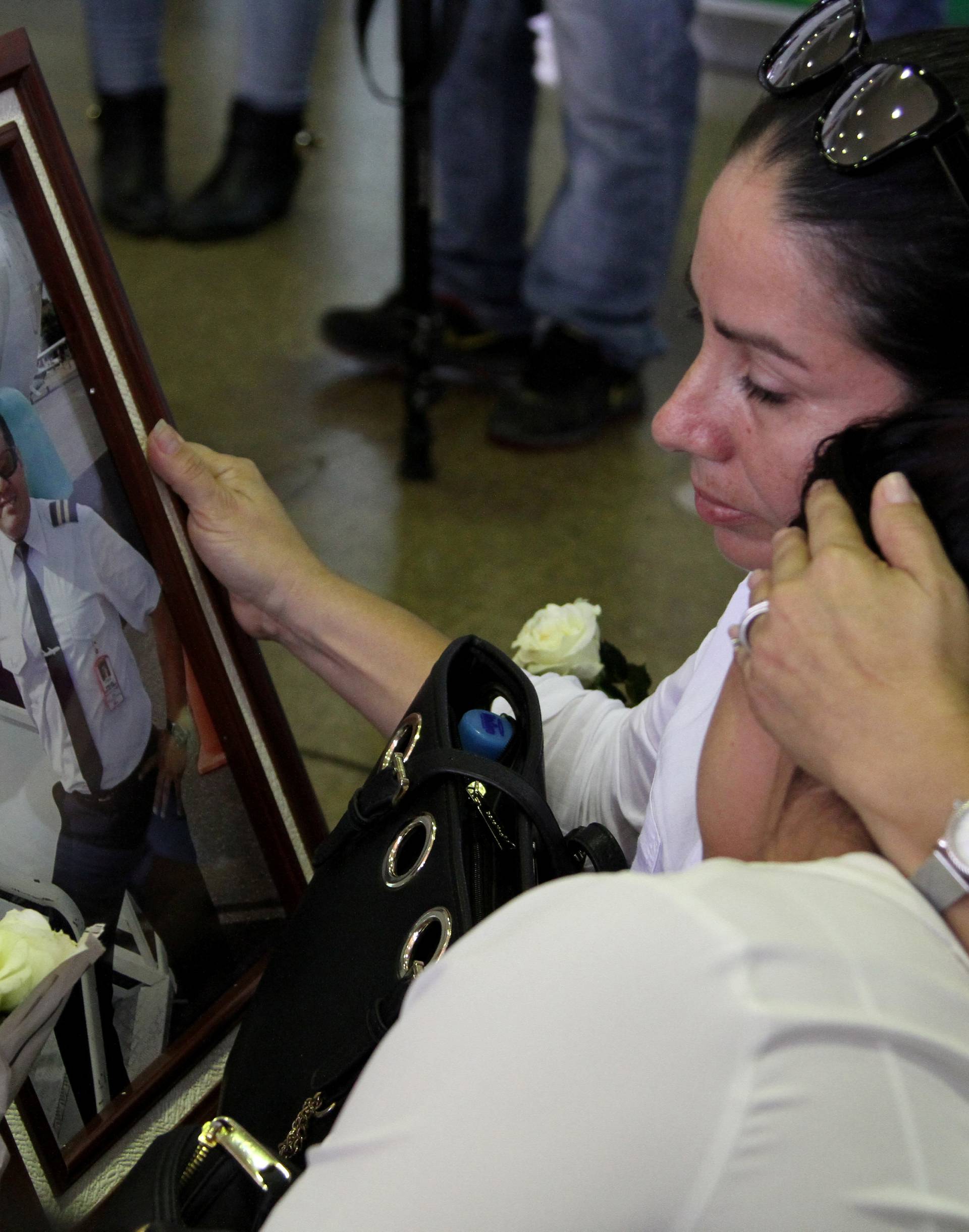 Relatives of Bolivian crew member David Vacaflor, who died when the plane carrying Brazilian soccer team Chapecoense crashed in Colombia, react at Viru Viru airport in Santa Cruz
