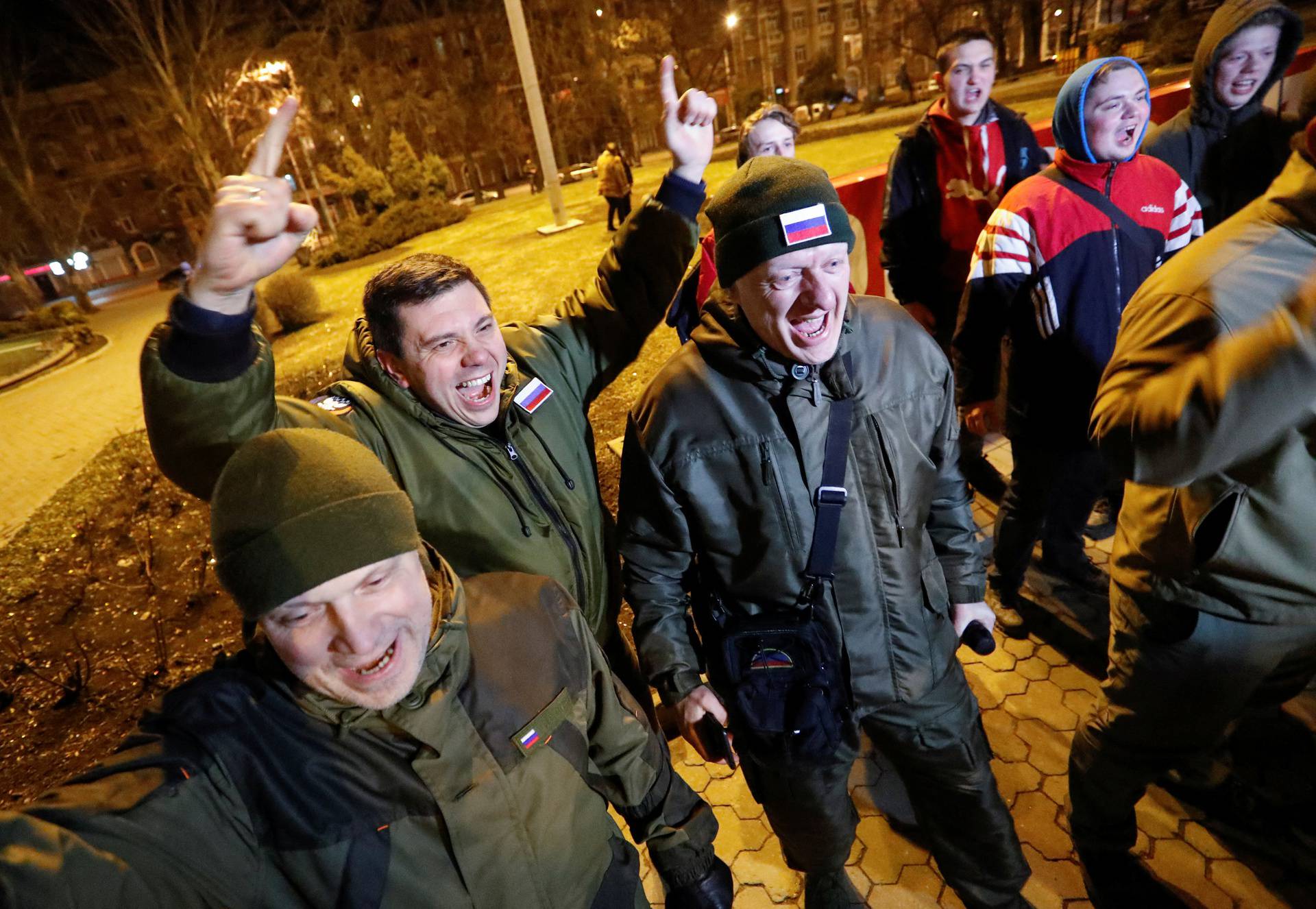Pro-Russian activists react in a street in Donetsk