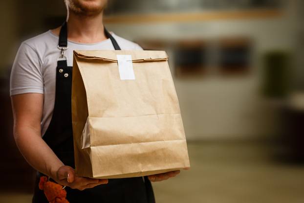 Diverse,Of,Paper,Containers,For,Takeaway,Food.,Delivery,Man,Is