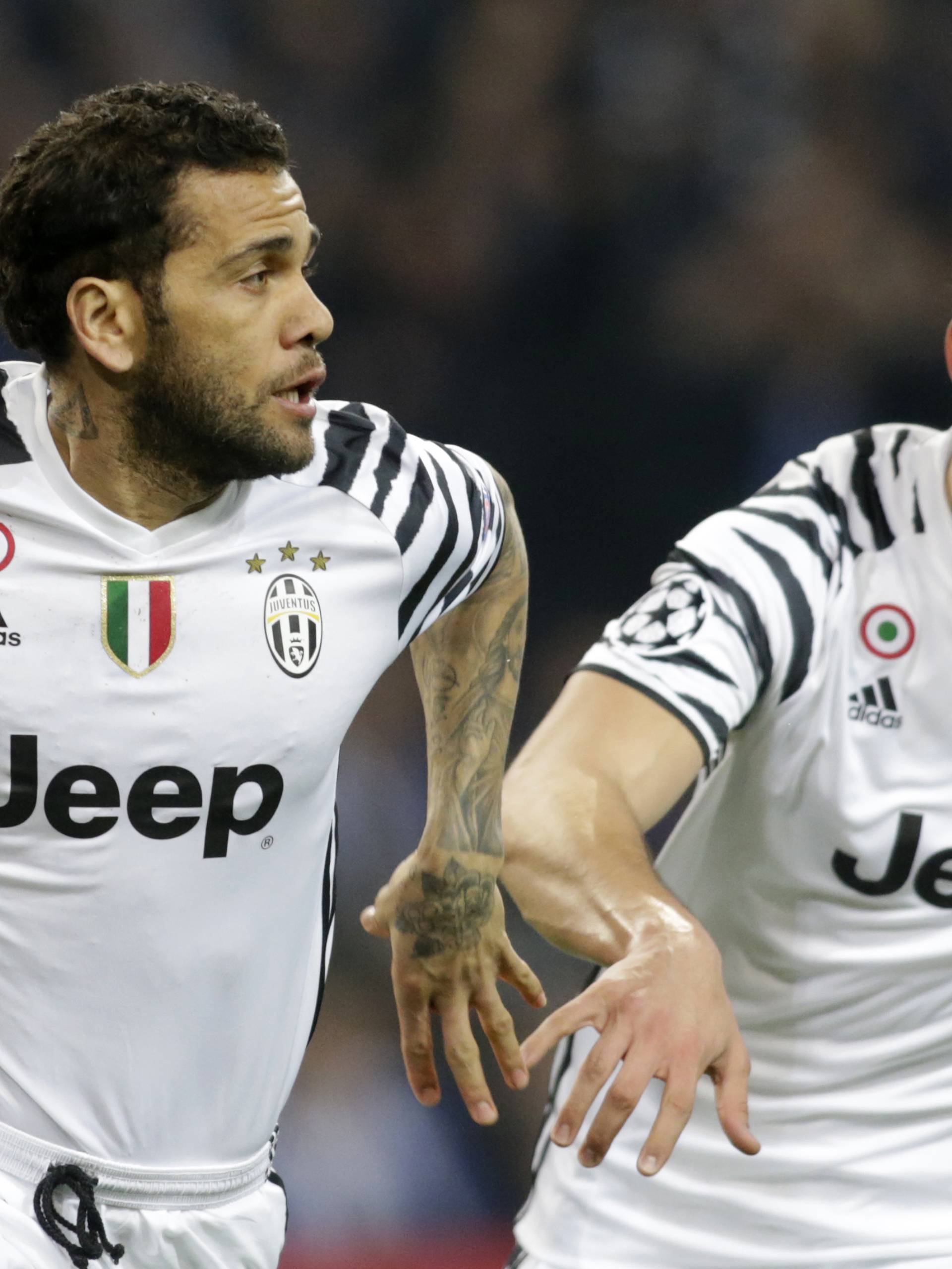 Juventus' Dani Alves celebrates scoring their second goal with Marko Pjaca