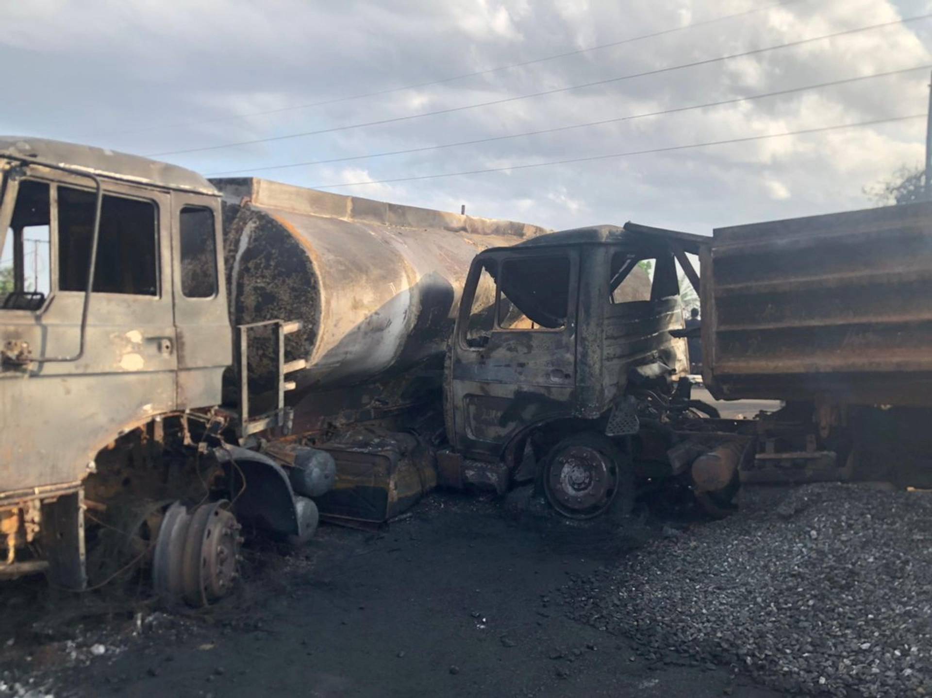 Burnt collided trucks are pictured after a fuel tanker explosion in Freetown