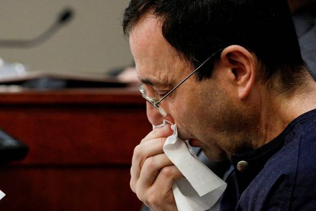 Larry Nassar, a former team USA Gymnastics doctor who pleaded guilty in November 2017 to sexual assault charges, sits in the courtroom during his sentencing hearing in Lansing, Michigan