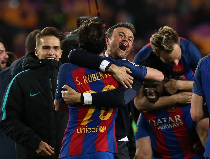 Barcelona coach Luis Enrique and Sergi Roberto celebrate after the game