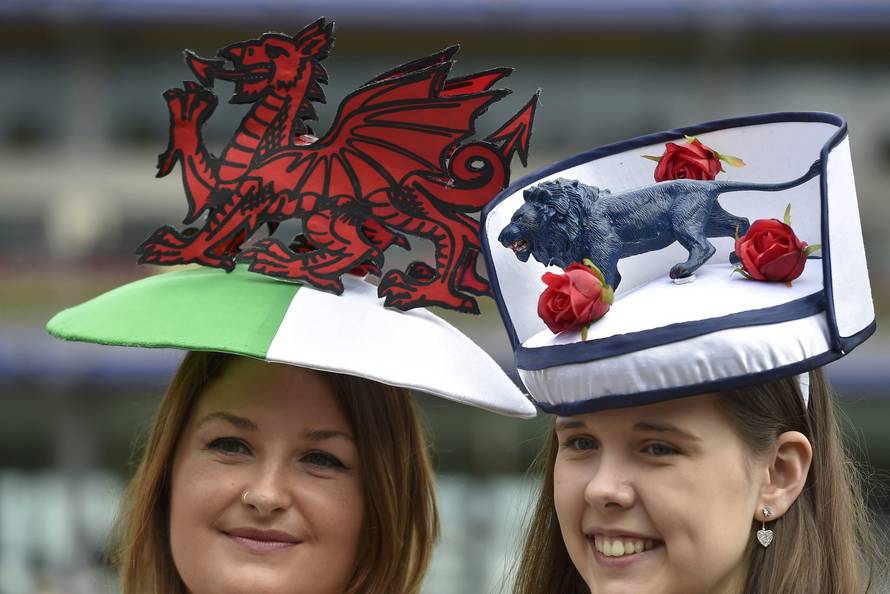 Britain Horse Racing Ladies Day Racegoers wear England and Wales themed hats