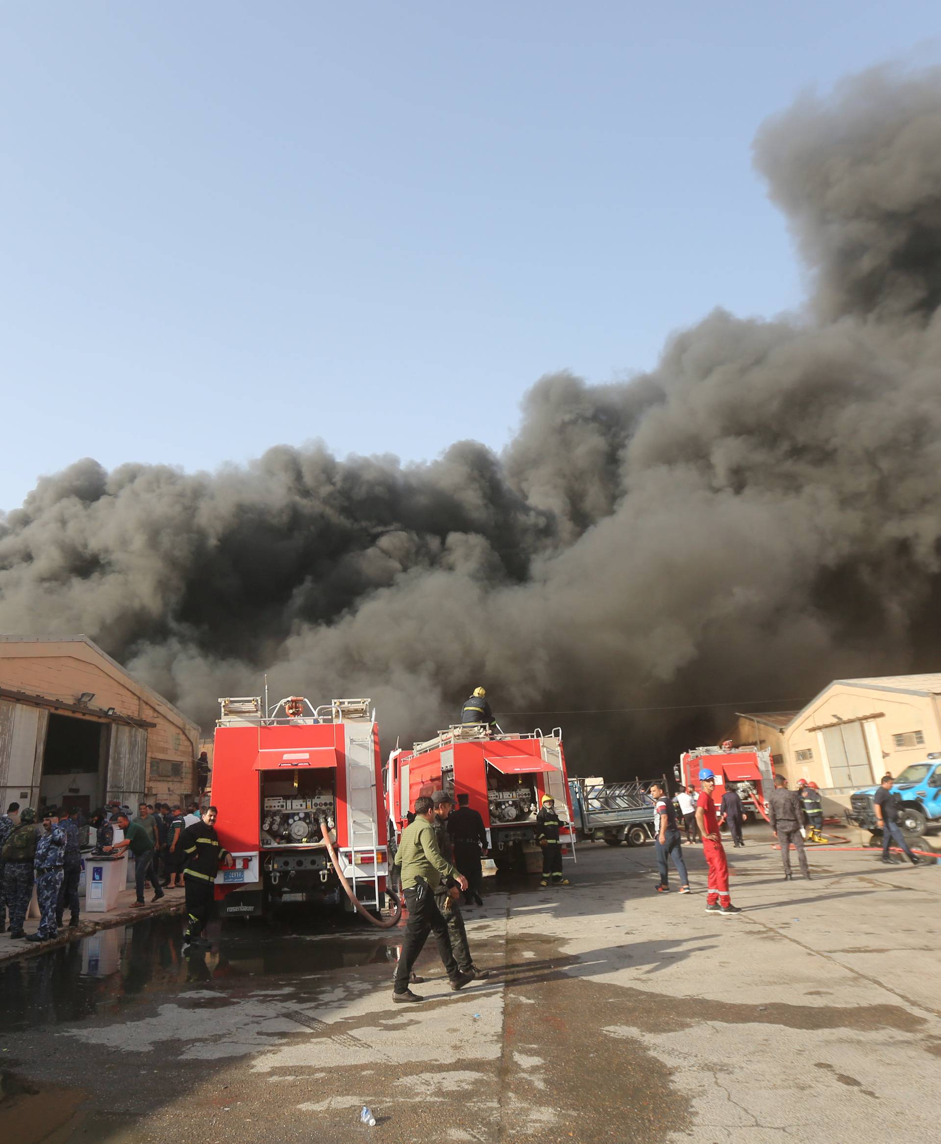Smoke rises from a storage site in Baghdad, housing ballot boxes from Iraq's May parliamentary election