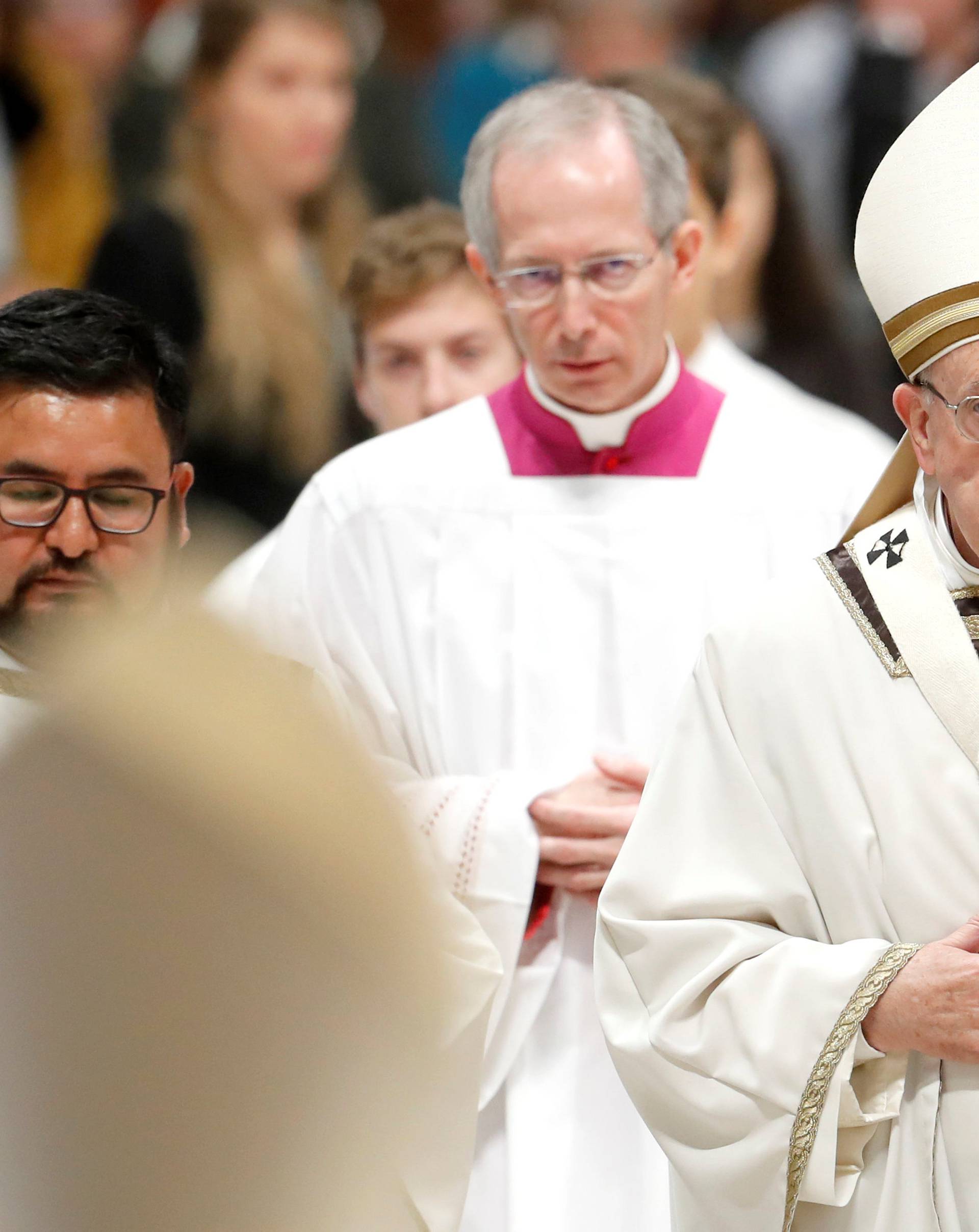 Pope Francis leaves after celebrating the Mass marking the Roman Catholic Church's World Day of the Poor, at the Vatican