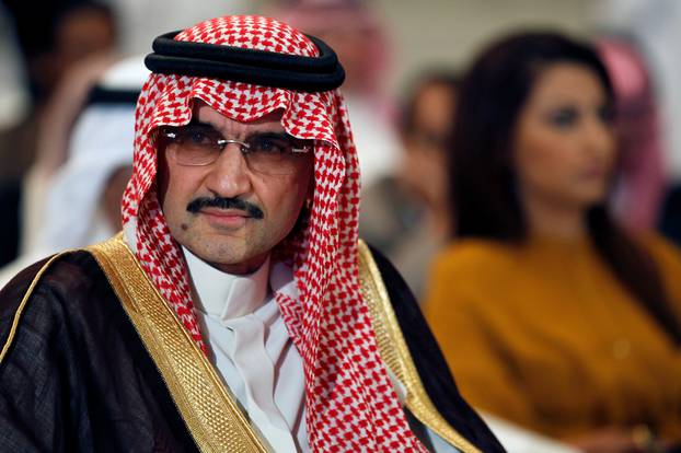 FILE PHOTO - Saudi billionaire Prince AlWaleed bin Talal looks on during a news briefing in Manama