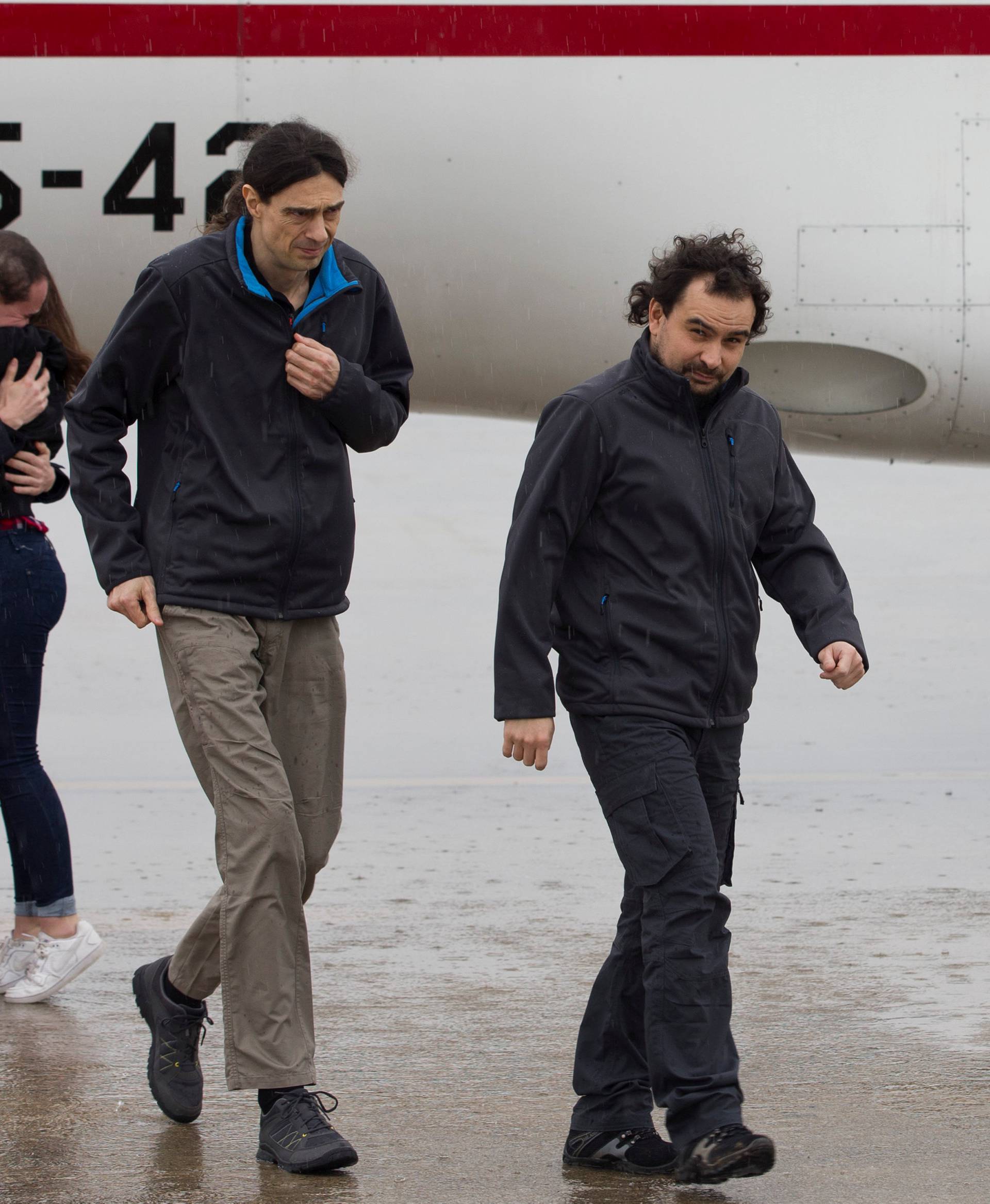 Pampliega, Lopez and Sastre, three Spanish freelance journalists who went missing in Syria last year and were believed to have been kidnapped, arrive at Torrejon's military airport, Spain