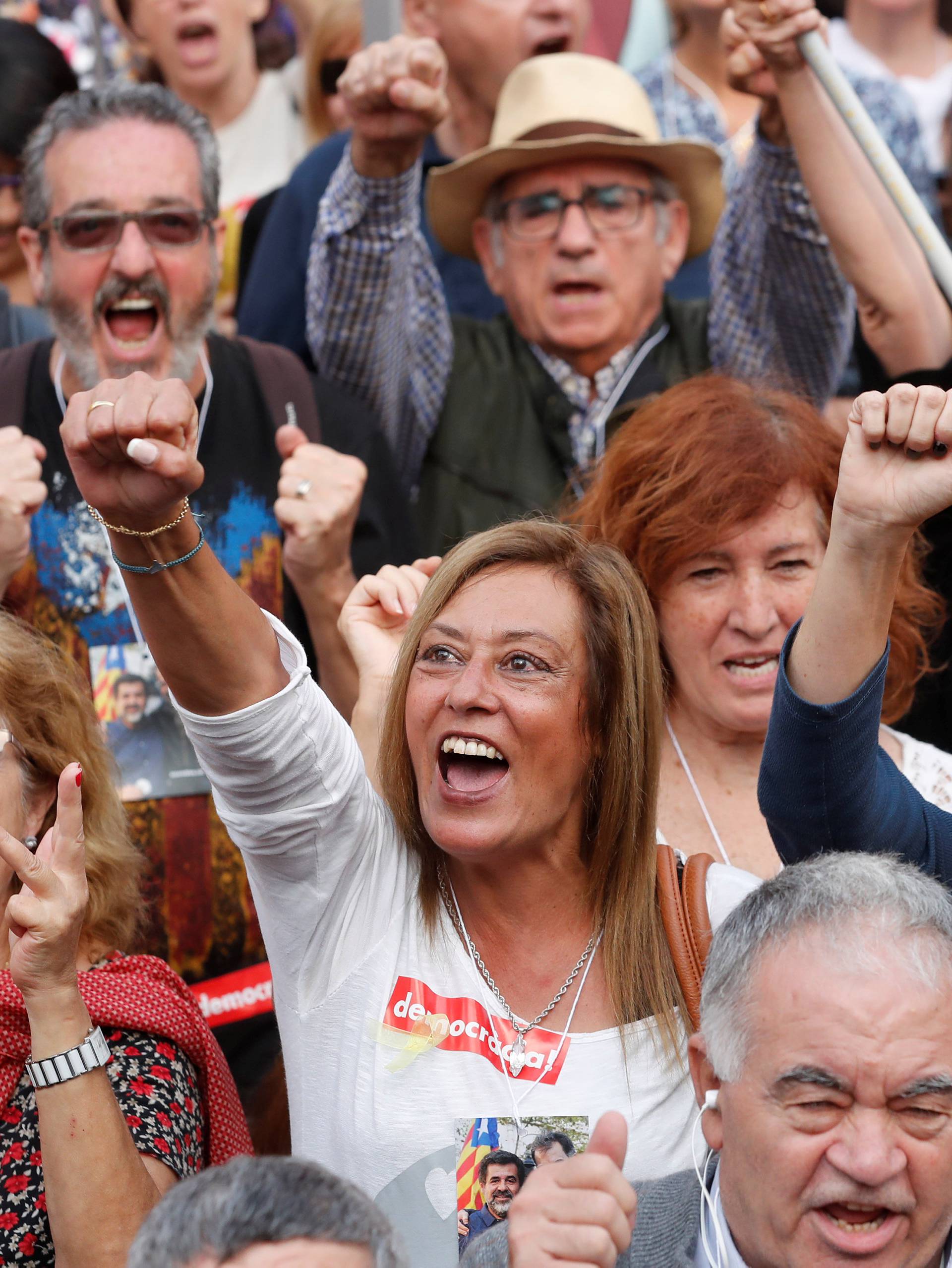 People react while the Catalan regional parliament votes for independence of Catalonia from Spain in Barcelona