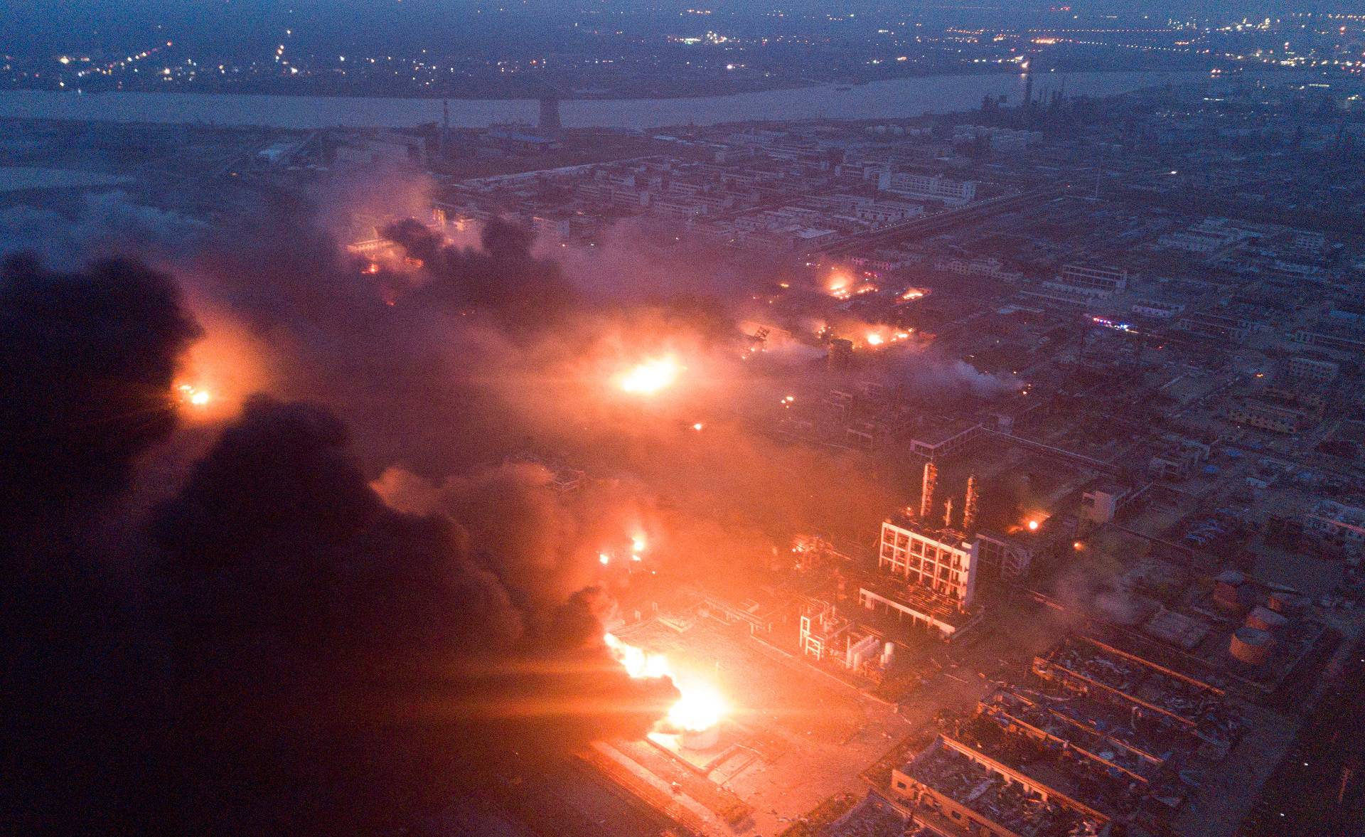 Smoke billows from fire following an explosion at the pesticide plant owned by Tianjiayi Chemical, in Xiangshui
