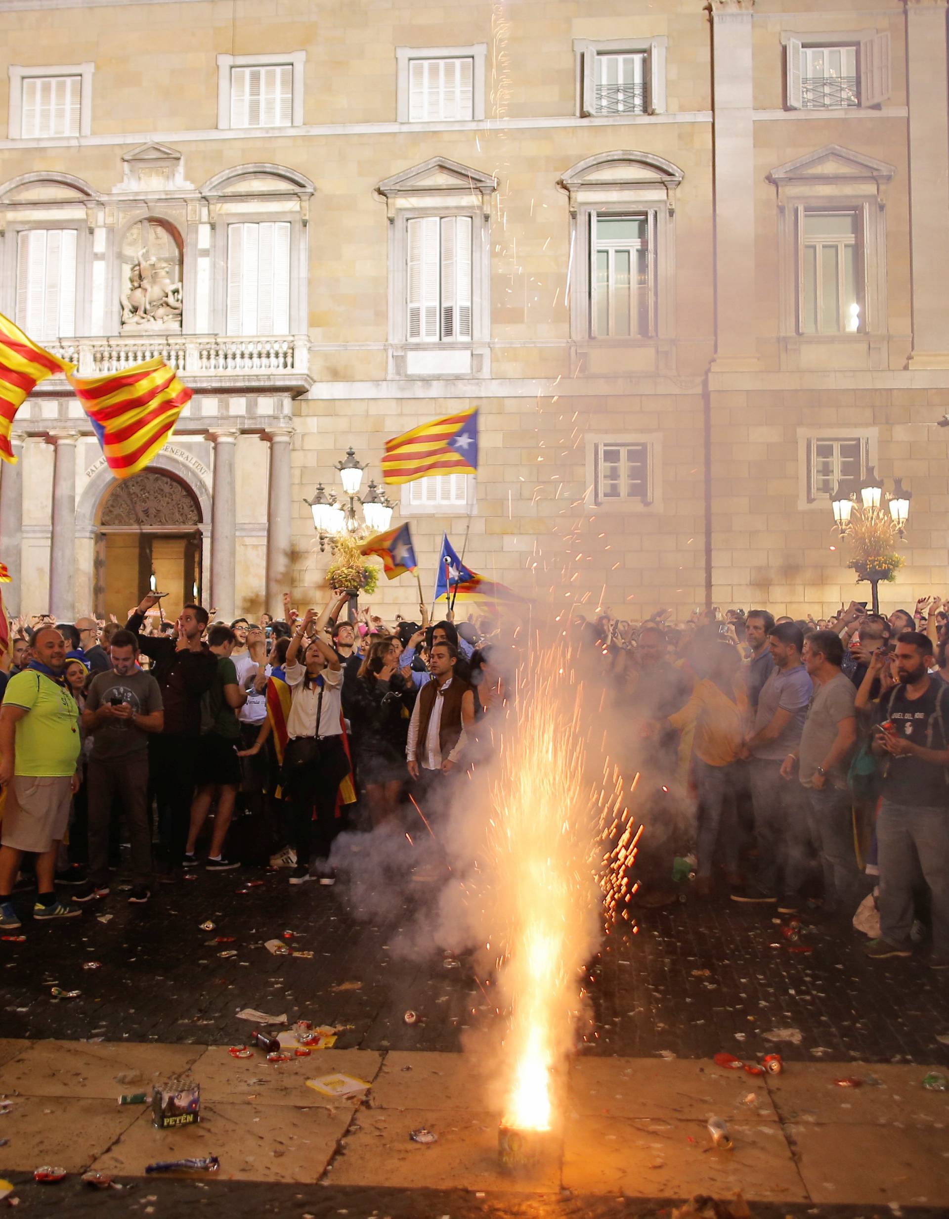 Fireworks are set off in front of the Catalan regional government headquarters during celebratrions after the Catalan regional parliament declared independence from Spain in Barcelona