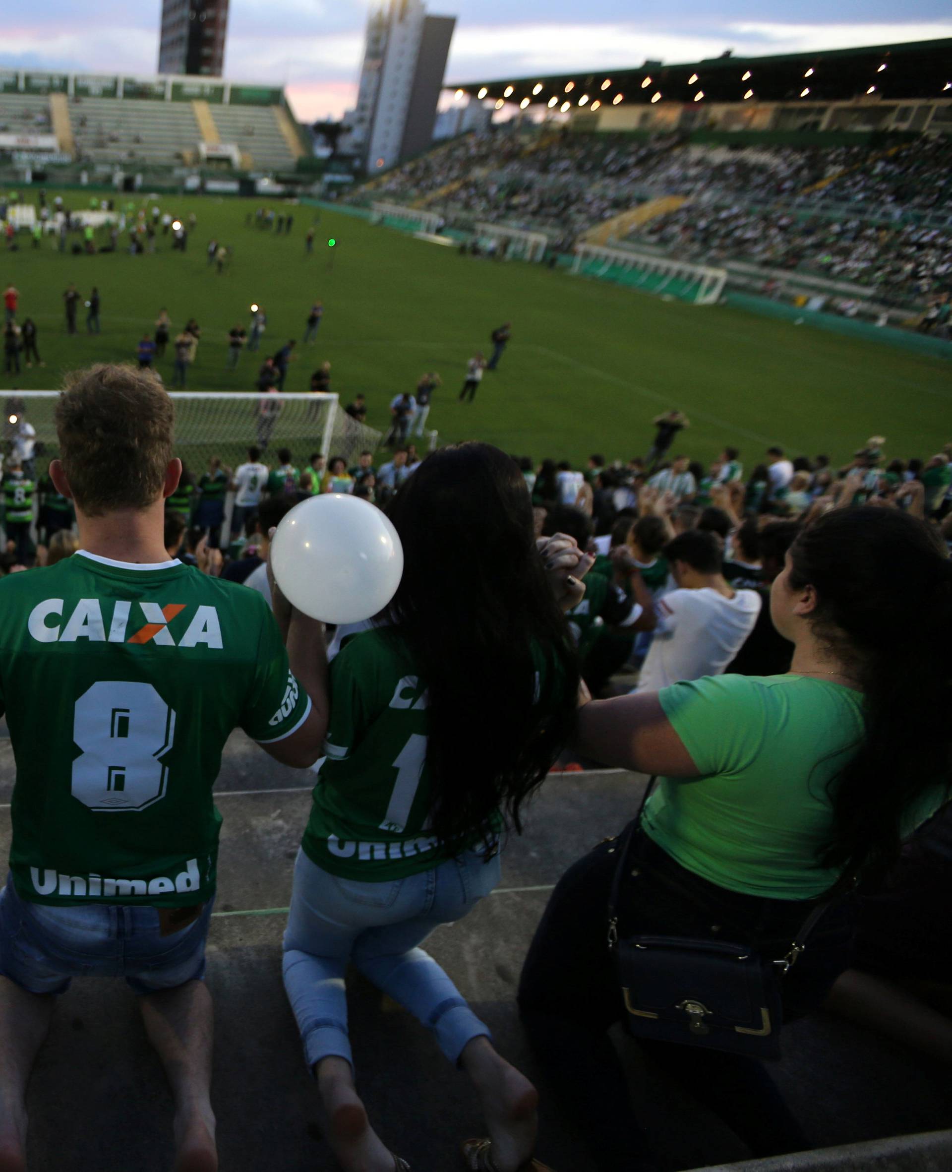 Fans of Chapecoense soccer team pay tribute to Chapecoense's players at the Arena Conda stadium in Chapeco