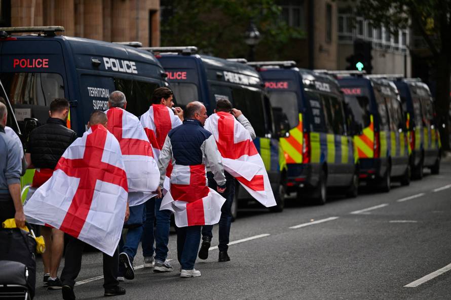 Anti-racism protesters gather to counter anti-immigration rally led by Tommy Robinson, in London
