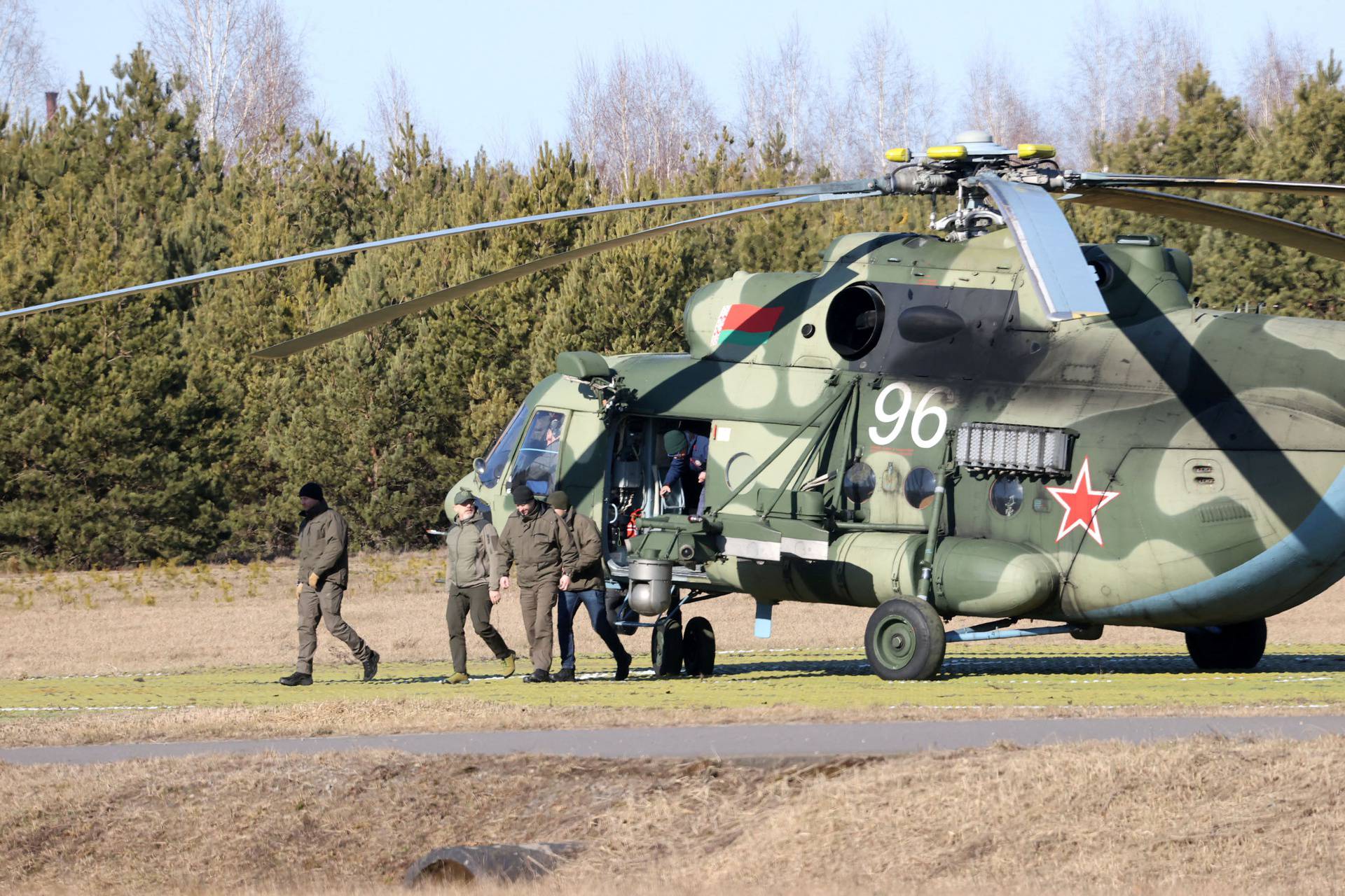 Members of the Ukrainian delegation arrive for talks with Russian representatives in the Gomel region