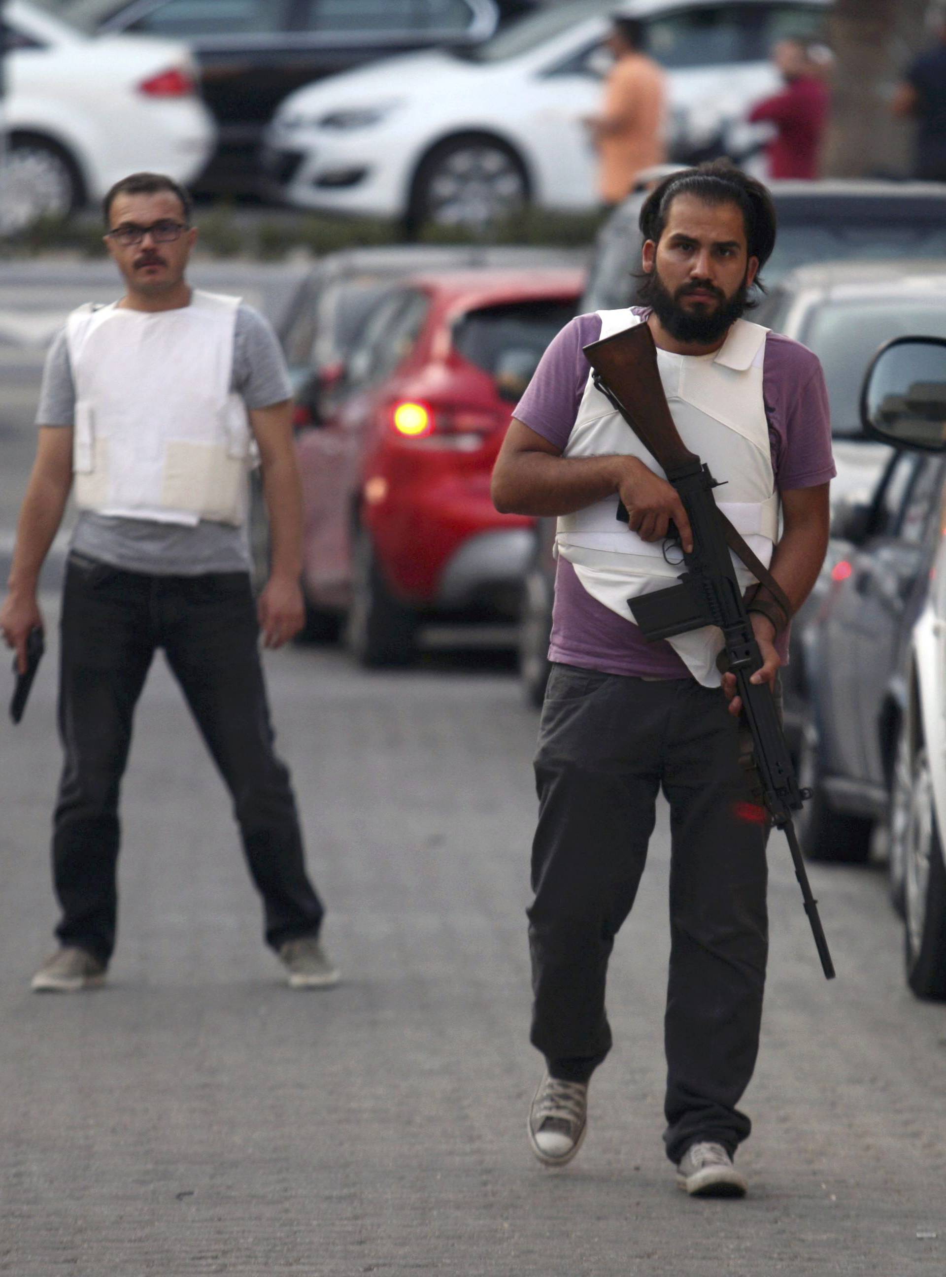 A plain clothes policeman patrols a street in the resort town of Marmaris