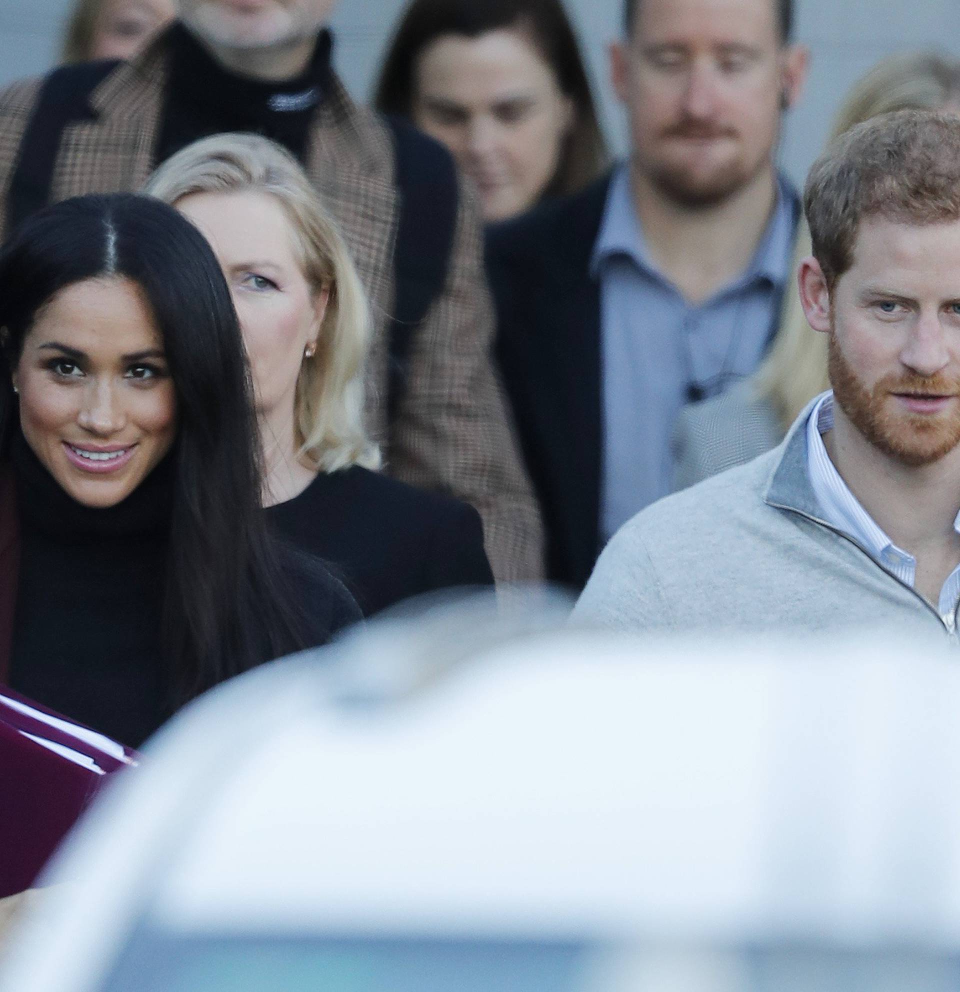 Prince Harry and his wife Meghan Markle pictured arriving in Sydney.