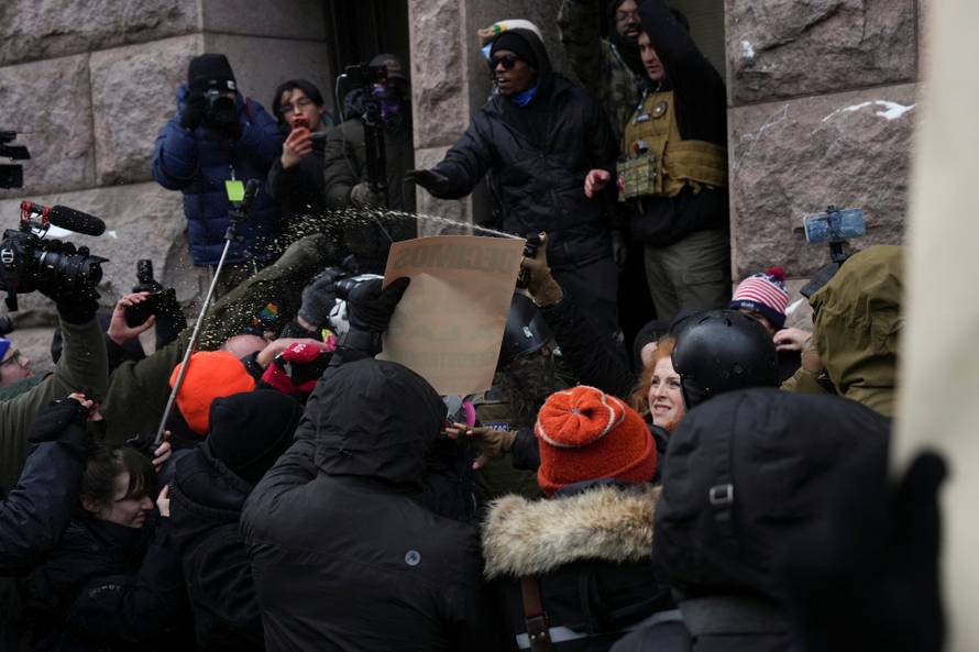 People attend the "March Against Minnesota Fraud" in Minneapolis
