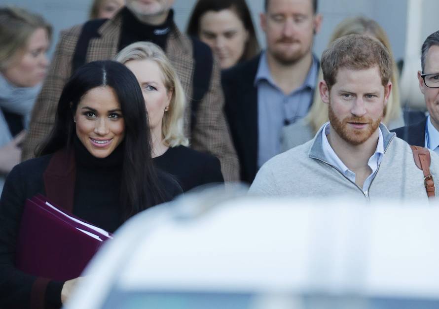 Prince Harry and his wife Meghan Markle pictured arriving in Sydney.