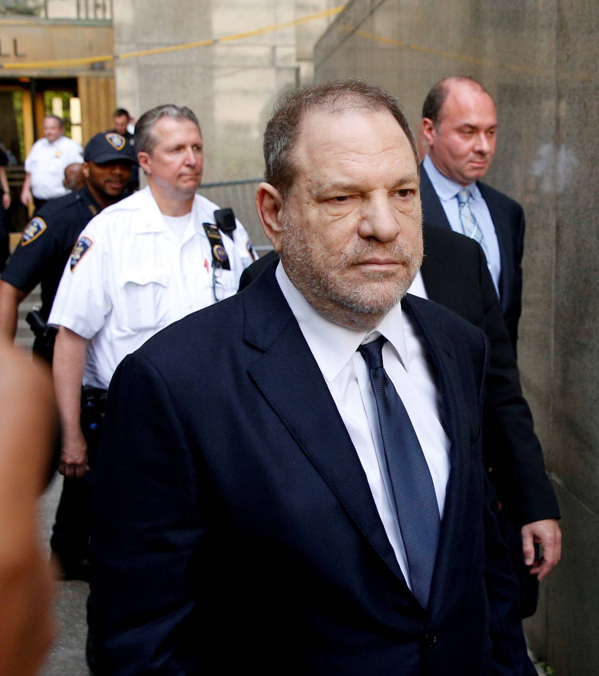 FILE PHOTO: Film producer Harvey Weinstein leaves court in Manhattan