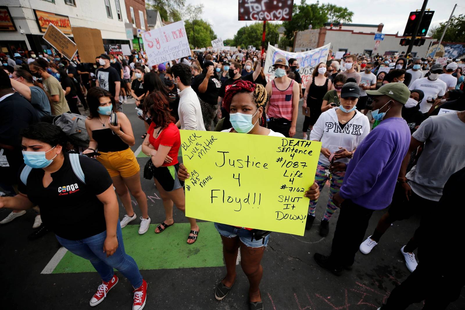 Protesters gather at the scene where Floyd was pinned down by a police officer in Minneapolis