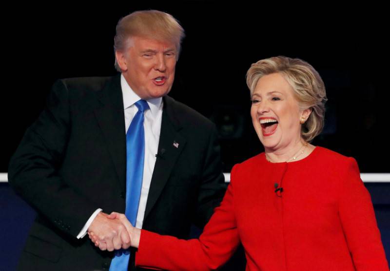 Republican U.S. presidential nominee Donald Trump shakes hands with Democratic U.S. presidential nominee Hillary Clinton at the conclusion of their first presidential debate at Hofstra University in Hempstead