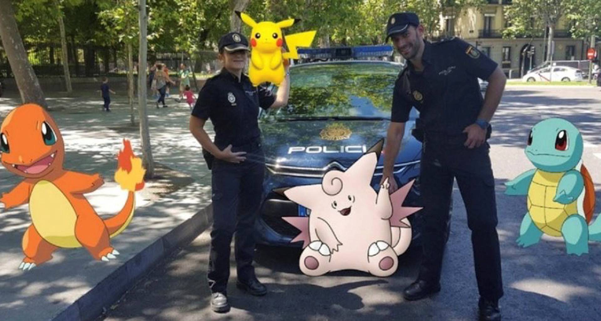 Handout photo of Spanish police posing with "Pokemon Go"  figures 
