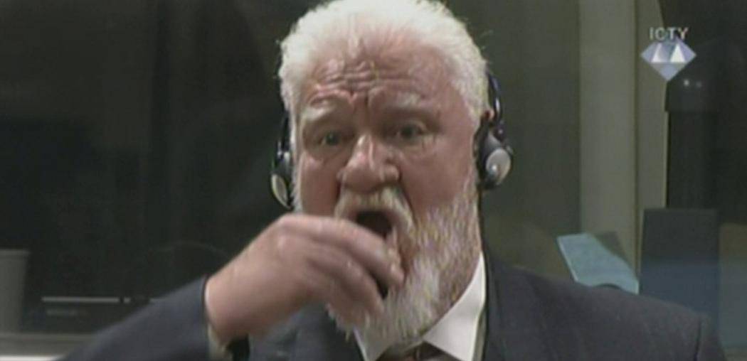 A wartime commander of Bosnian Croat forces, Slobodan Praljak, is seen during a hearing at the U.N. war crimes tribunal in the Hague