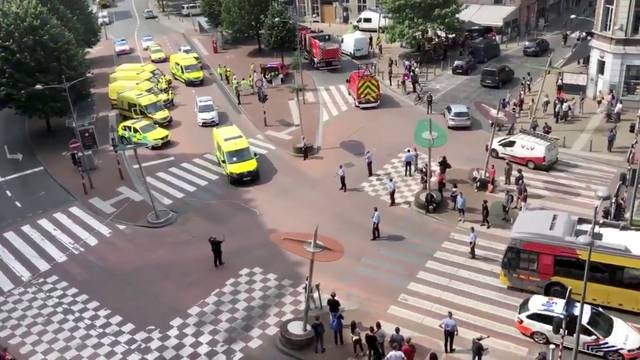 Emergency responders are seen following a shooting in Liege