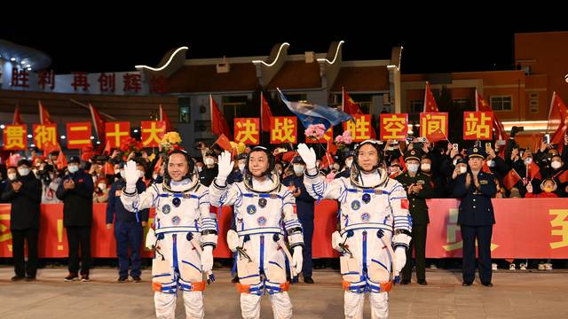 Astronauts Fei Junlong, Deng Qingming and Zhang Lu at Jiuquan Satellite Launch Center
