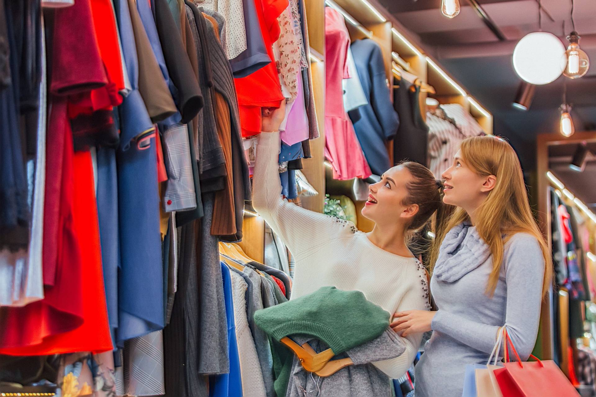 Girlfriends in the store after making their purchases have found for themselves another good thing.