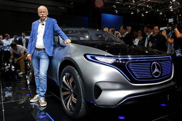 Dieter Zetsche, CEO of Daimler and Head of Mercedes-Benz, poses in front of a Mercedes EQ Electric car on media day at the Mondial de l'Automobile in Paris