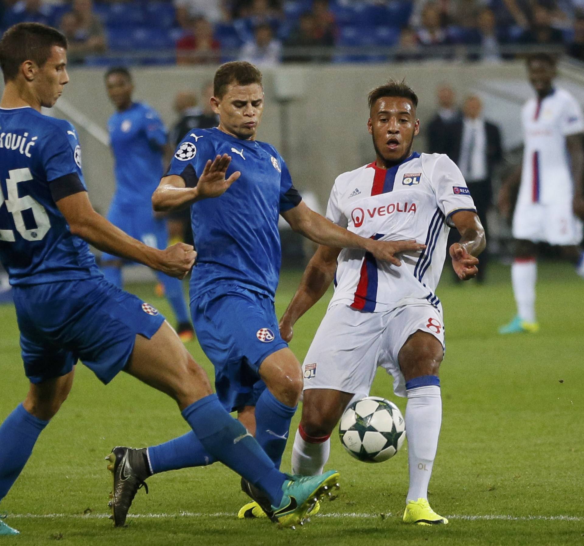 Dinamo Zagreb's Filip Benkovic and team mate Jonas in action with Olympique Lyon's Corentin Tolisso.