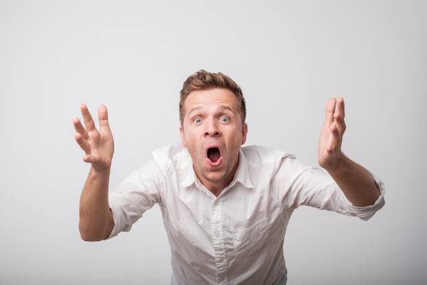 Shocked Caucasian Man Screaming.
