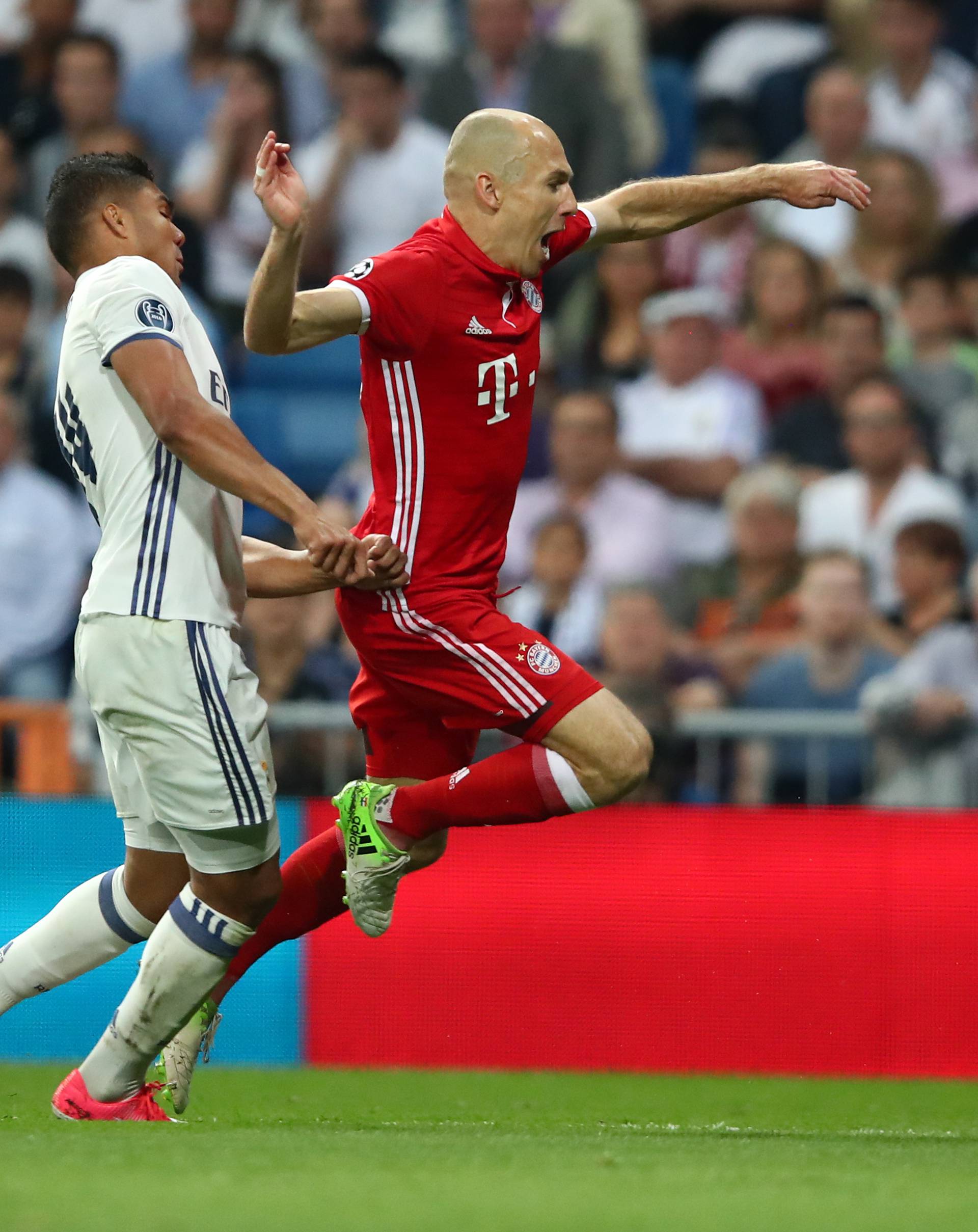 Bayern Munich's Arjen Robben is fouled by Real Madrid's Casemiro for a penalty