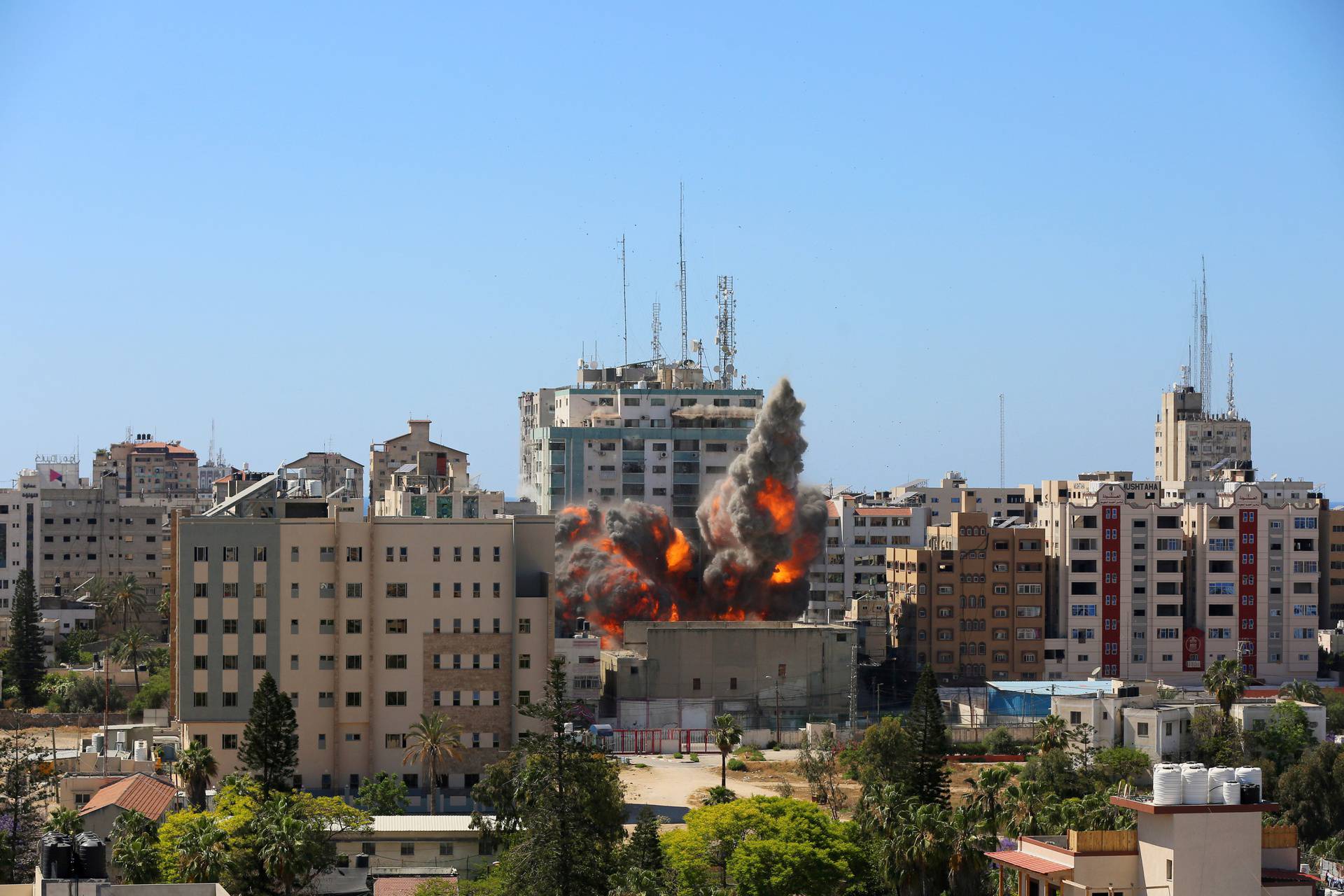 A tower housing AP, Al Jazeera offices collapses after Israeli missile strikes in Gaza city