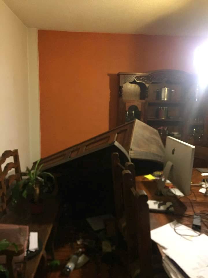 Fallen furniture in an apartment is pictured after an earthquake in Mexico City