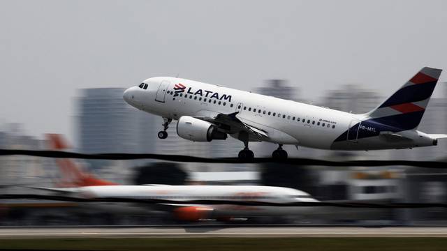 FILE PHOTO: A LATAM Airlines Brasil Airbus A319 plane takes off from Congonhas airport in Sao Paulo, Brazil