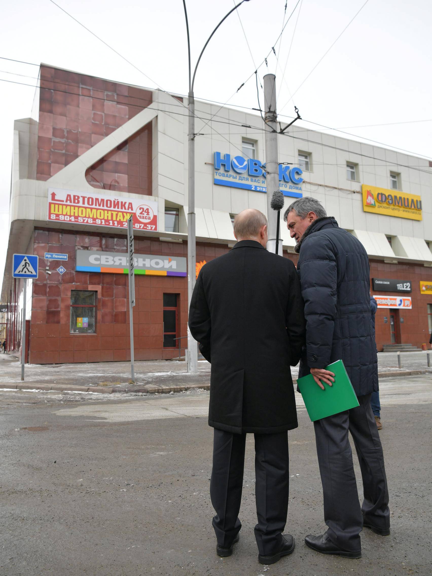 Russian President Vladimir Putin visits the site of fire, that killed at least 64 people at a busy shopping mall, in Kemerovo