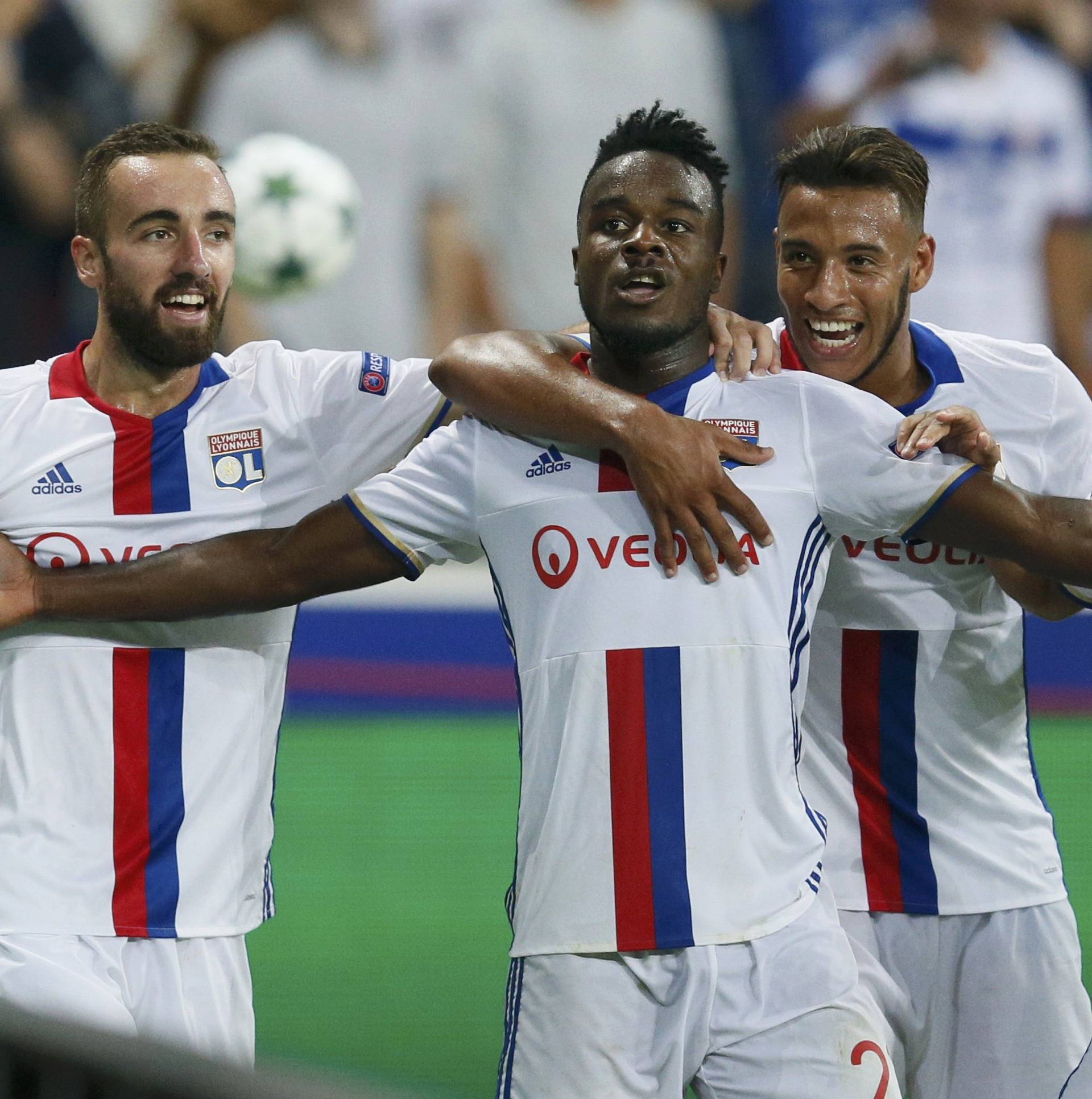 Olympique Lyon's Maxwel Cornet celebrates with tean mates after he scored against Dinamo Zagreb