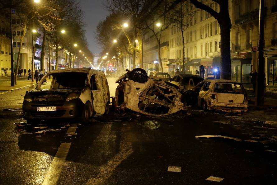 Burned cars are seen on avenue Kleber after clashes with protesters wearing yellow vests, a symbol of a French drivers' protest against higher diesel taxes, in Paris