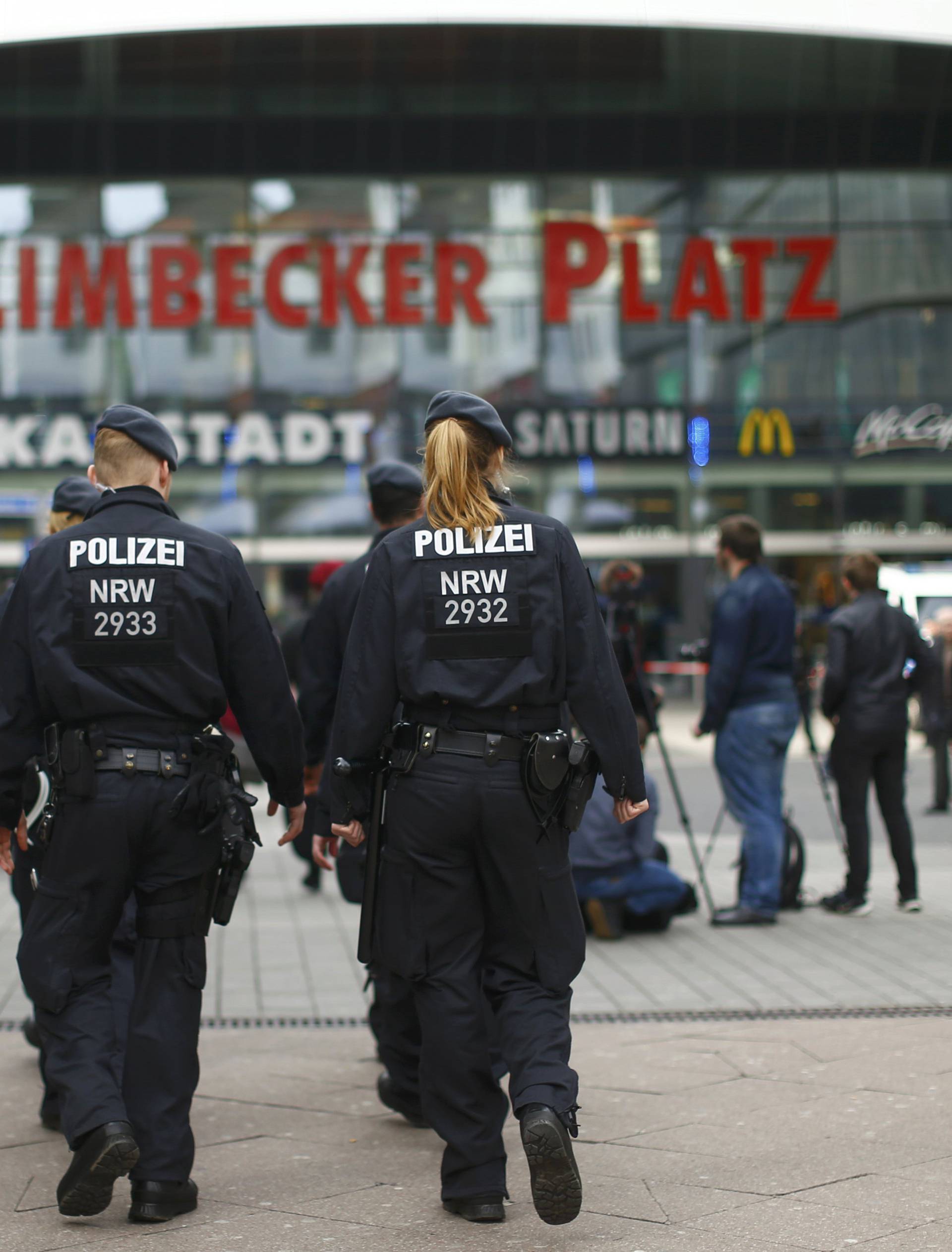 Police walks towards the Limbecker Platz shopping mall in Essen