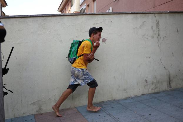 Mass crossings of migrants on foot and by sea from Morocco into Spanish territory, in Ceuta