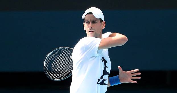 Novak Djokovic practices on court ahead of 2022 Australian Open