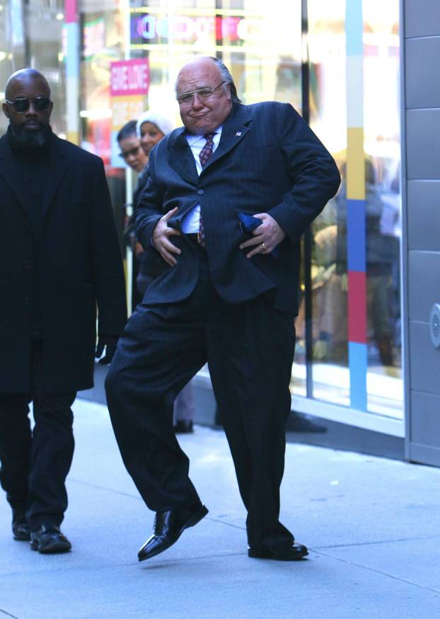 Russell Crowe gets playful with his prosthetic belly while filming "The Loudest Voice" in NYC