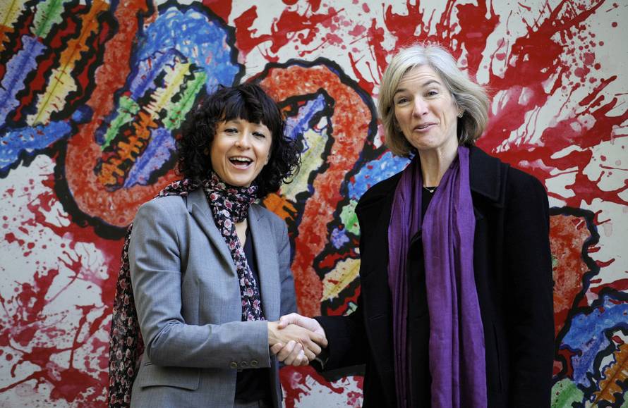 FILE PHOTO: French microbiologist Emmanuelle Charpentier (L) and professor Jennifer Doudna of the U.S. pose for the media during a visit to a painting exhibition by children about the genome, at the San Francisco park in Oviedo